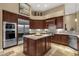 Gourmet kitchen with stainless steel appliances, granite countertops, and a center island at 14708 E Canyoncrest Ct, Fountain Hills, AZ 85268