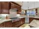 Gourmet kitchen showcasing stainless steel appliances, granite countertops, and custom cabinetry at 14708 E Canyoncrest Ct, Fountain Hills, AZ 85268