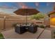 Outdoor patio features comfortable seating with shade, complemented by desert landscaping and decorative lighting at 14708 E Canyoncrest Ct, Fountain Hills, AZ 85268