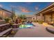 Serene backyard with pool, water feature, and patio, designed for relaxation and outdoor enjoyment at 14708 E Canyoncrest Ct, Fountain Hills, AZ 85268