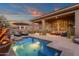 Sparkling pool with covered patio seating, perfect for relaxation and enjoying the backyard oasis at 14708 E Canyoncrest Ct, Fountain Hills, AZ 85268