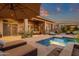Inviting backyard with a shimmering pool, lounge chairs, and covered patio space at 14708 E Canyoncrest Ct, Fountain Hills, AZ 85268