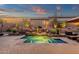Stunning backyard pool with desert plants and a small waterfall feature to create relaxing retreat at 14708 E Canyoncrest Ct, Fountain Hills, AZ 85268