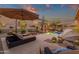 Inviting backyard pool area with lush desert landscaping, lounge chairs, and decorative water features at 14708 E Canyoncrest Ct, Fountain Hills, AZ 85268