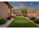 Beautiful backyard putting green and BBQ area, perfect for outdoor relaxation and entertainment at 14708 E Canyoncrest Ct, Fountain Hills, AZ 85268
