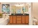 Bathroom features a double vanity with dark countertops, and a soaking tub at 15827 S 12Th Pl, Phoenix, AZ 85048