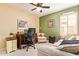 Relaxing bedroom features a cozy chair, and a ceiling fan for comfort and a relaxing atmosphere at 15827 S 12Th Pl, Phoenix, AZ 85048