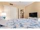 Cozy bedroom includes closet, dresser, and view into the bathroom at 15827 S 12Th Pl, Phoenix, AZ 85048