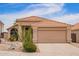 Charming single-story home featuring a well-maintained yard with desert landscaping and a neutral color palette at 15827 S 12Th Pl, Phoenix, AZ 85048