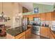 Spacious kitchen boasts stainless appliances, a center island, and an open layout with ample counter space at 15827 S 12Th Pl, Phoenix, AZ 85048