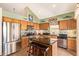 Bright kitchen features stainless steel appliances, center island with seating, and granite countertops at 15827 S 12Th Pl, Phoenix, AZ 85048