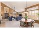 Open floor plan with living and dining areas featuring vaulted ceilings, abundant natural light, and stylish furnishings at 15827 S 12Th Pl, Phoenix, AZ 85048