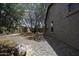 Low maintenance backyard featuring gravel landscaping, mature trees, and a block wall at 1742 E Chaparral Dr, Casa Grande, AZ 85122