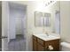 Bright bathroom featuring a vanity with a sink, a mirror, and tile floors at 1742 E Chaparral Dr, Casa Grande, AZ 85122