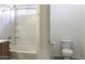 Bright bathroom with tiled bathtub and shower combination, and tiled floors at 1742 E Chaparral Dr, Casa Grande, AZ 85122