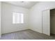 Bright bedroom offers a large window with blinds and a closet with sliding doors at 1742 E Chaparral Dr, Casa Grande, AZ 85122