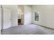 Carpeted bedroom with ensuite bathroom and view of the exterior landscape at 1742 E Chaparral Dr, Casa Grande, AZ 85122