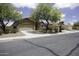 Charming single-story home featuring a two-car garage and mature landscaping in a suburban neighborhood at 1742 E Chaparral Dr, Casa Grande, AZ 85122