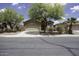 Charming single-story home featuring a two-car garage and mature landscaping in a suburban neighborhood at 1742 E Chaparral Dr, Casa Grande, AZ 85122