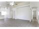 Expansive and bright living room features tile floors and access to adjacent rooms in the home at 1742 E Chaparral Dr, Casa Grande, AZ 85122