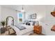 Bright bedroom with a window view, stylish decor, and lots of natural light at 17479 W Victory St, Goodyear, AZ 85338