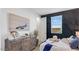 Nautical themed bedroom with a stylish accent wall and decorative dresser at 17479 W Victory St, Goodyear, AZ 85338