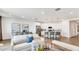 Bright and airy living room featuring modern furnishings and an open concept design connecting to the kitchen at 17479 W Victory St, Goodyear, AZ 85338