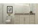 Clean bathroom featuring a modern vanity, toilet, and neutral color scheme at 17539 W Victory St, Goodyear, AZ 85338