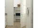 Spacious bathroom with a view into a well-organized closet and marble shower at 17539 W Victory St, Goodyear, AZ 85338