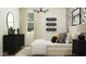 Modern bedroom with trendy decor, stylish lighting, and a comfortable bed at 17539 W Victory St, Goodyear, AZ 85338