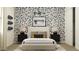 Stylish bedroom featuring unique wallpaper, modern lamps, and a comfortable bed at 17539 W Victory St, Goodyear, AZ 85338