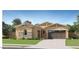 Charming single-story home featuring a two-car garage, desert landscaping, and neutral color palette at 17539 W Victory St, Goodyear, AZ 85338