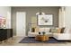 Comfortable living room with stylish decor, modern lighting, and a cozy sofa at 17539 W Victory St, Goodyear, AZ 85338