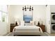 Serene main bedroom with elegant lighting, a comfortable bed, and stylish nightstands at 17539 W Victory St, Goodyear, AZ 85338