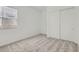 Bright bedroom features neutral carpet, natural light, and closet with sliding doors at 17545 W Victory St, Goodyear, AZ 85338