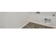 Laundry room with white walls, tiled floor, and washer/dryer hookups and water shut-off at 17545 W Victory St, Goodyear, AZ 85338
