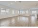 Spacious living room filled with natural light and ample room for furniture, perfect for relaxing and entertaining guests at 17545 W Victory St, Goodyear, AZ 85338