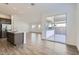 Open concept living room connecting kitchen and outdoor patio, great for entertaining and enjoying indoor/outdoor living at 17545 W Victory St, Goodyear, AZ 85338