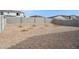 Spacious backyard with rock landscaping and trees at 17806 W Vogel Ave, Waddell, AZ 85355