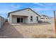 Backyard with rock landscaping, trees and covered patio at 17806 W Vogel Ave, Waddell, AZ 85355