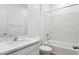 Bright white bathroom featuring white marble shower surround and vanity at 17806 W Vogel Ave, Waddell, AZ 85355