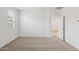 Neutral bedroom with soft carpeting, large window, and natural light at 17806 W Vogel Ave, Waddell, AZ 85355