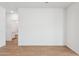 Clean, spacious bedroom features tile flooring and neutral paint at 17806 W Vogel Ave, Waddell, AZ 85355