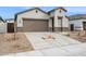 Charming single-Gathering home featuring a two-car garage, neutral stucco and rock landscaping at 17806 W Vogel Ave, Waddell, AZ 85355