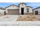 Charming single-Gathering home featuring a two-car garage, neutral stucco and rock landscaping at 17806 W Vogel Ave, Waddell, AZ 85355
