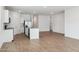 Open-concept kitchen with stainless steel appliances and a center island at 17806 W Vogel Ave, Waddell, AZ 85355
