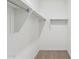 Bright walk-in closet offering ample shelving space at 17806 W Vogel Ave, Waddell, AZ 85355
