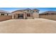 View of the home's backyard, featuring block wall, spacious open area and covered patio at 18759 E Panchito Dr, Gold Canyon, AZ 85118