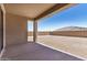 Covered patio overlooking a vast backyard with block wall surround at 18759 E Panchito Dr, Gold Canyon, AZ 85118