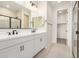 The spacious bathroom boasts double sink vanity and black hardware and a glass shower at 18759 E Panchito Dr, Gold Canyon, AZ 85118